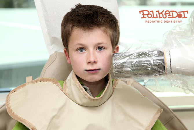 boy getting teeth x-rays done